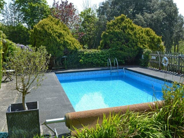 Heated swimming pool in grounds (shared with owner and other cottages on-site) | Stable End - Peregrine Hall Cottages, Lostwithiel