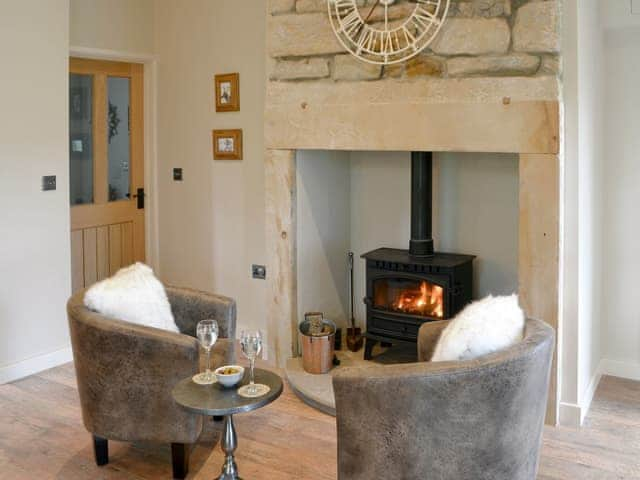 Cosy wood burner in the kitchen/dining are | Ferncliffe Cottage, Thropton, near Morpeth