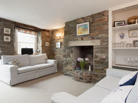 Main living room with stone clad feature fireplace | Church Street 17, Salcombe
