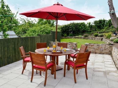  Enclosed lawned garden with patio and garden furniture | Dolfran Bach, Dolwen, near Betws-yn-Rhos, Abergele