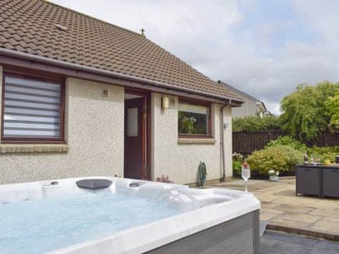 Attractive patio area with hot tub | Ben The Hoose, Anstruther