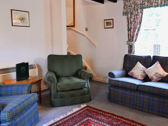 Living room with ornamental period range | Timberwick Green - Akeld Manor, Akeld, Wooler