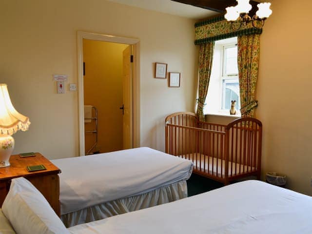 Twin bedroom with en-suite shower room | Bizzie Lizzie Cottage - Akeld Manor, Akeld, Wooler