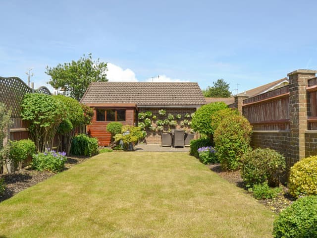 Enclosed lawned garden with patio area | Rosedene, Bembridge