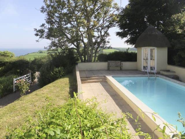 Luxurious swimming pool | Monks Thatch Cottage, Otterton