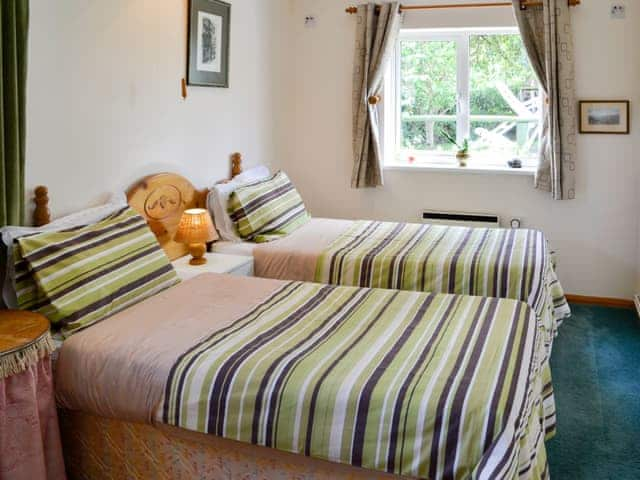 Inviting bedroom with zip and link beds for either a double or twin beds | The Annexe at Russets, Isle Brewers, near Taunton