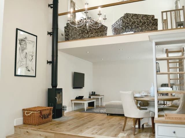 Well presented open plan living space with a wood burner | Stirton Burrow, Stirton, near Skipton