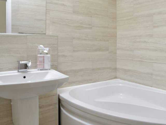 Family bathroom with corner bath and shower cubicle | Sunflower Cottage - Hoxne Cottages, Strensall, near York