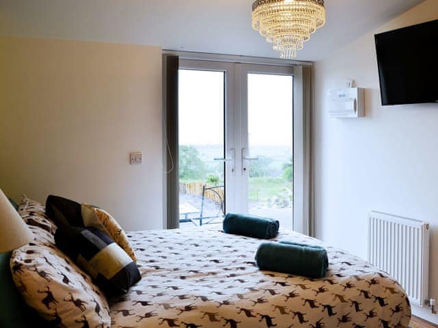 Delightful double bedroom with access to patio | The Retreat - Underwood Farm, Stroat, near Chepstow