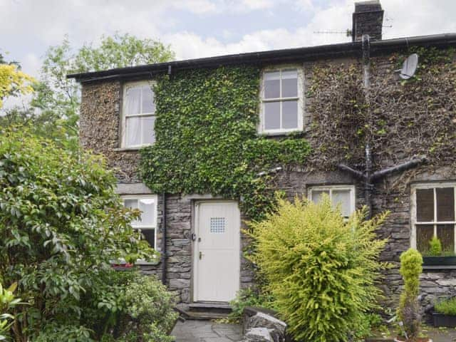 Mature garden at rear entrance to property | Roundhill Cottages 1, Grasmere