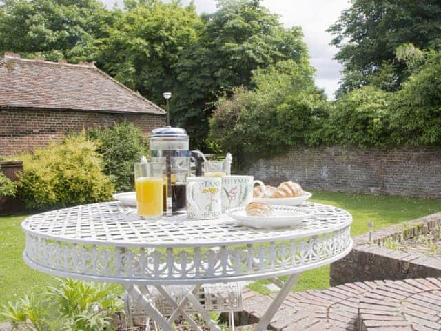 Patio area with outdoor furniture | The Bothy - The Dovecote, Staple, near Wingham