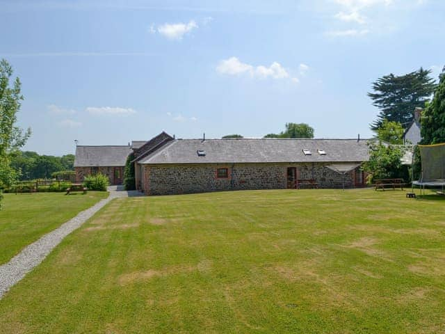 Beautifully manicured lawned gardens | Stowford Lodge Holiday Cottages, Langtree, near Great Torrington