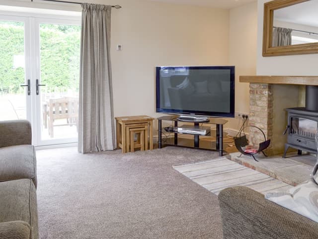 Spacious living room with French doors to patio | Old Dairy - Andover Lane Farm, Faberstown, near Andover