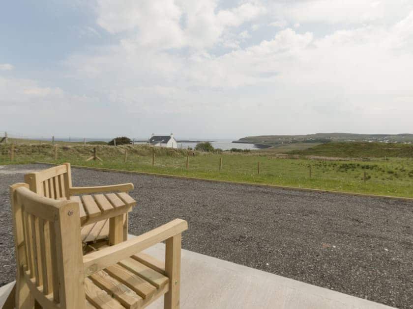 Fabulous coastal view from the patio | Storr - Brogaig Cottages, Brogaig, near Staffin