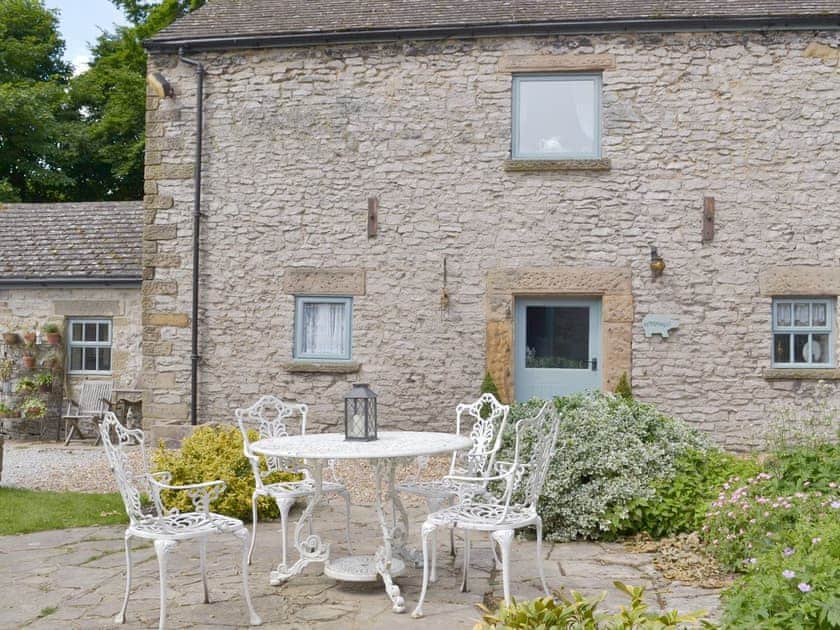 Idyllic holiday home with outdoor furniture on patio | Pippinwell, Over Haddon, near Bakewell