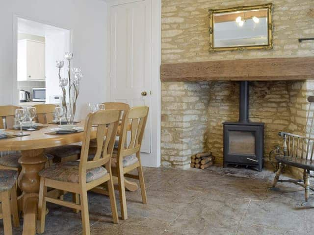 Feature fireplace with wood burner in dining area | The Plough, Bampton, near Witney