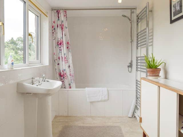 Light and airy family bathroom with shower over bath | The Plough, Bampton, near Witney