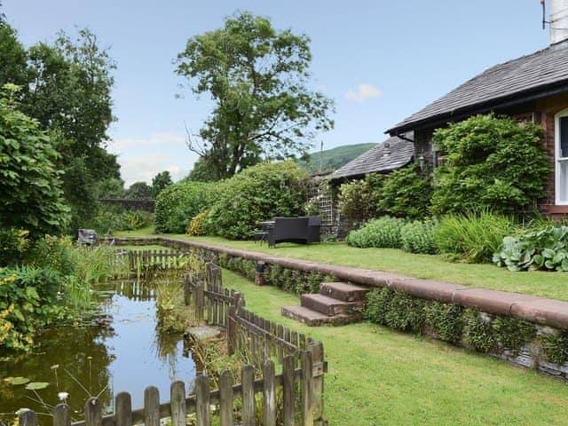 Beautifully manicured garden with wildlife pond | Station Master&rsquo;s House - Torver Station Cottages, Torver, near Coniston