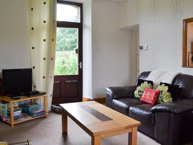 Comfortable living area with direct access to the garden | Ticket Office - Torver Station Cottages, Torver, near Coniston