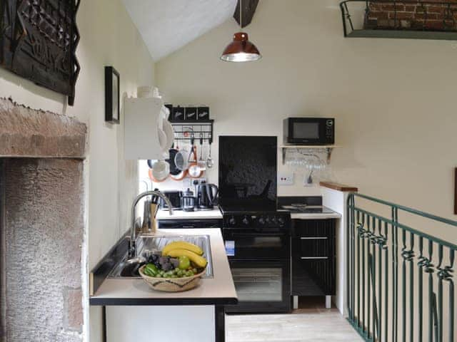 Galleried compact kitchen | Grooms Cottage - Arkleby Holiday Homes, Arkleby, near Cockermouth