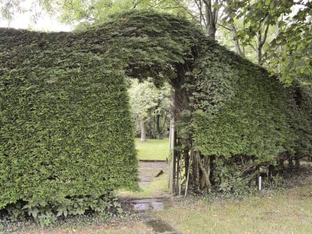 Secluded area within the garden | Grooms Cottage - Arkleby Holiday Homes, Arkleby, near Cockermouth