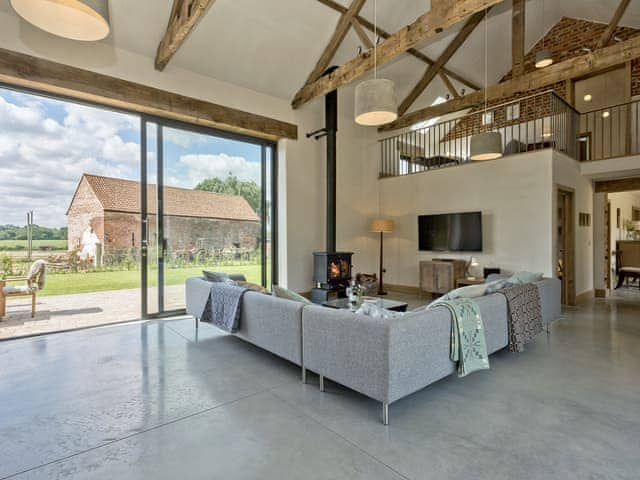 Living room with vaulted ceiling and patio doors | Old Hall Farm Barn, Kerdiston, near Norwich