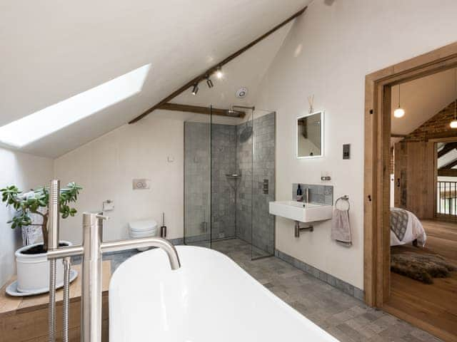 Bathroom with stand alone bath and walk- in shower | Old Hall Farm Barn, Kerdiston, near Norwich