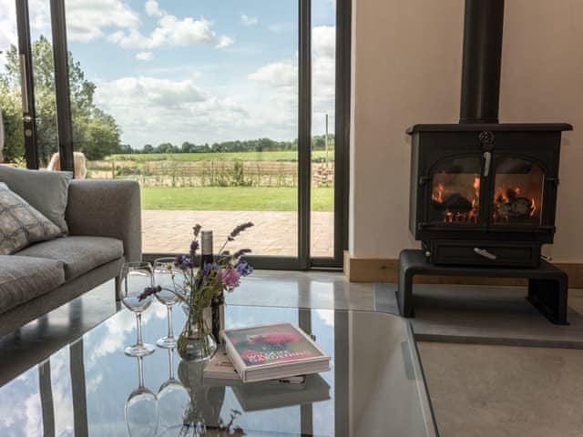 Living room with wood burning stove | Old Hall Farm Barn, Kerdiston, near Norwich