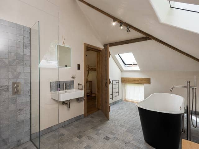 Bathroom with walk-in shower and stand alone bath | Old Hall Farm Barn, Kerdiston, near Norwich