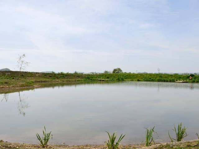 Tranquil on-site lake | Clapham Holme Farm Cottages, Great Hatfield, near Hornsea