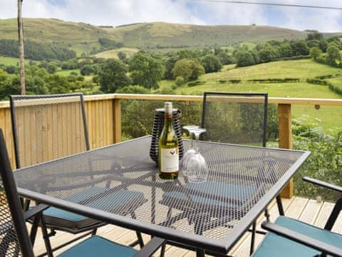 Decked terrace overlooking panoramic scenery | Wern Ddu Cottage, Penybontfawr, near Oswestry