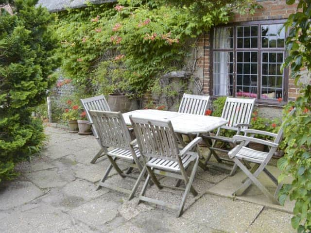 Paved patio with outdoor furniture | Thatched Cottage, Witton, near North Walsham