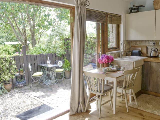 Open plan living space with double doors to patio area | The Figgery, Bittaford, near Ivybridge