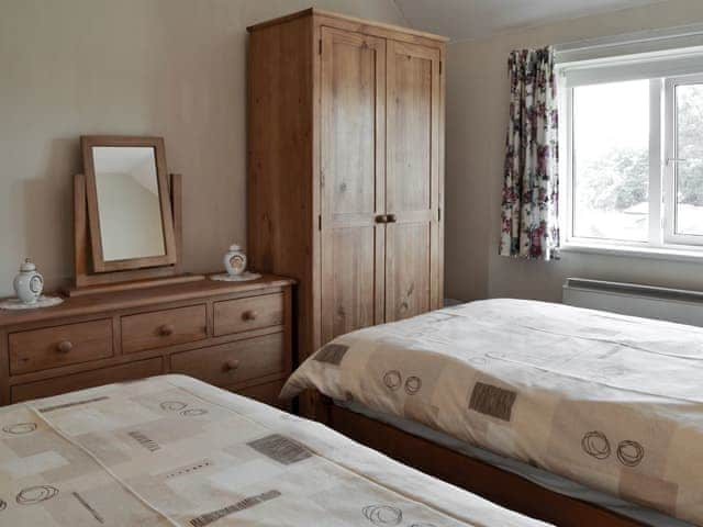 Tastefully furnished bedroom with twin beds  | Eventide, Broom, near Biggleswade