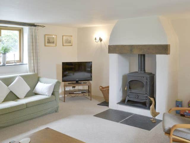 Welcoming living room with wood burner | The Shippon, St Gennys, Bude