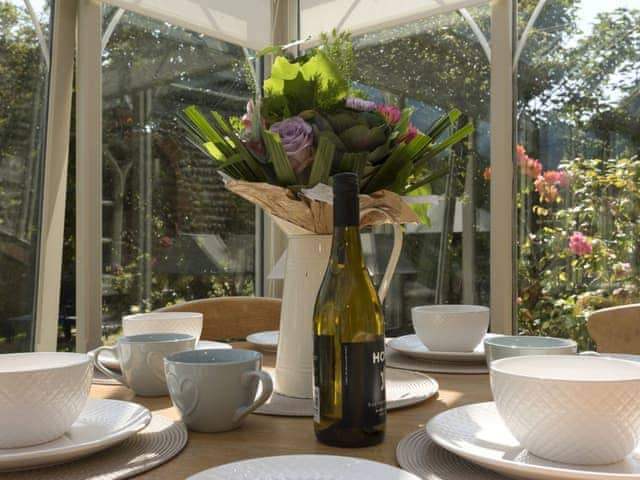 Inviting conservatory with dining area | Dell Cottage, Mundesley, near North Walsham