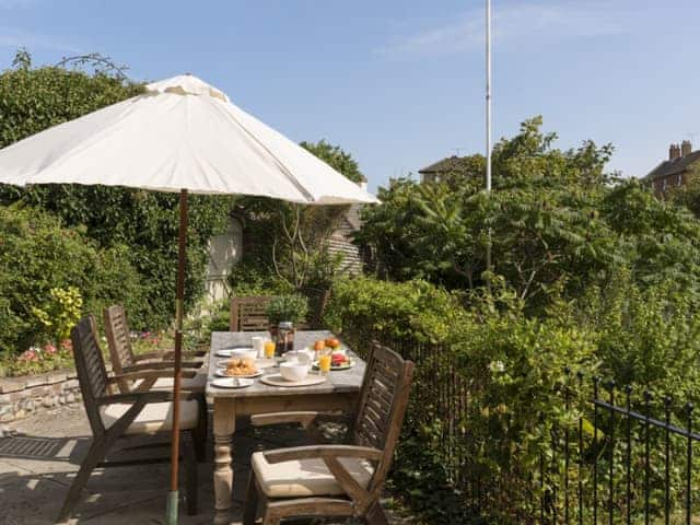 Spectacular patio area looking over the garden | Dell Cottage, Mundesley, near North Walsham