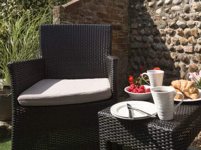 Charming sitting area with garden furniture | Dell Cottage, Mundesley, near North Walsham