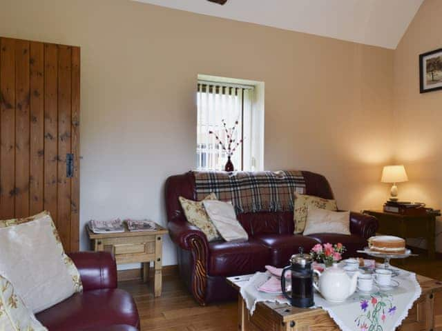 Beamed living room with wood-burning stove | Alfie&rsquo;s Barn, Ambrosden