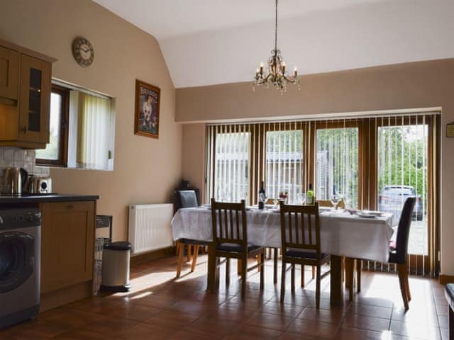 Large kitchen/dining room with terracotta tiled floor and French doors | Alfie&rsquo;s Barn, Ambrosden