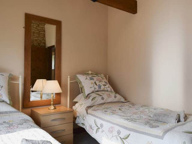 Twin bedroom with exposed stone walls | Alfie&rsquo;s Barn, Ambrosden