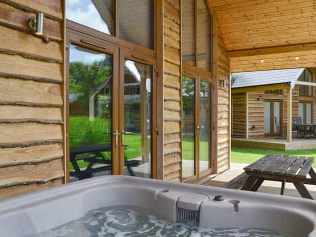 Private hot tub on decking | Campbell Lodge, Thorpe on the Hill, near Lincoln