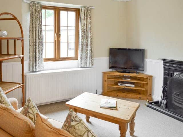 Welcoming living area | Hayloft - Penmorvah Manor Courtyard Cottages, Budock Water, near Falmouth