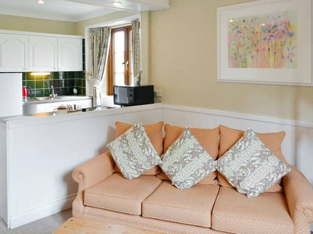 Comfy seating within living area | Hayloft - Penmorvah Manor Courtyard Cottages, Budock Water, near Falmouth