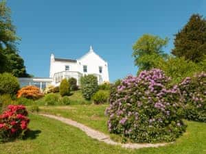 Set in a subtatial and well-planted garden | Munro&rsquo;s, Rothesay, Isle of Bute