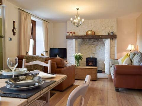 Attractive and warm living and dining room | Moss Cottage, Burry Port, near Llanelli