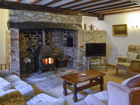 Charming beamed living room | Woodmans Cottage - The Old Timberyard, Puncknowle, Dorchester