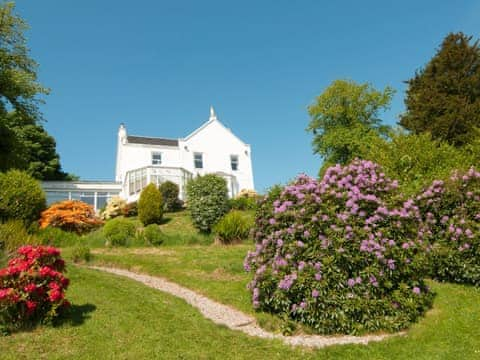 Set in a subtatial and well-planted garden | Munro&rsquo;s, Rothesay, Isle of Bute