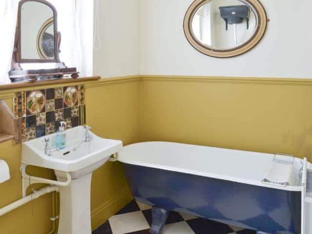 Free standing roll-top bath in bathroom with separate shower cubicle | Malthouse Barn, Elmsted, near Canterbury