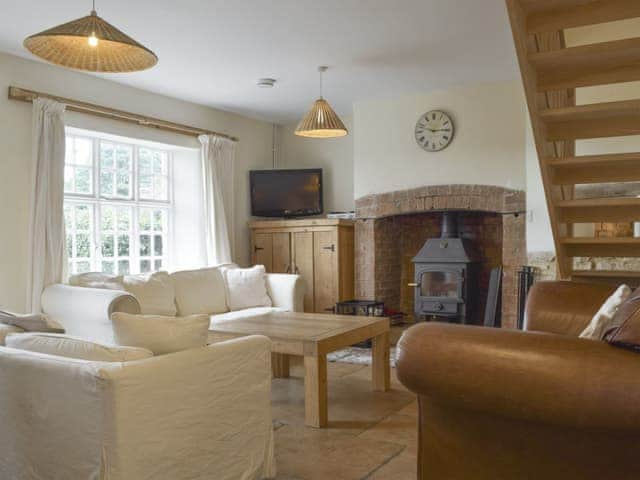 Delightful living area with wood burner | South View Cottage, Dean, near Chadlington